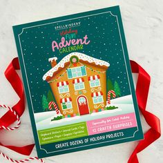 a holiday card with a gingerbread house and candy canes next to red ribbon