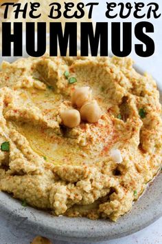 hummus in a white bowl with text overlay that reads the best ever hummus