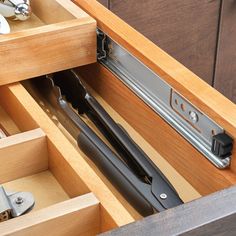 an open drawer with tools in it