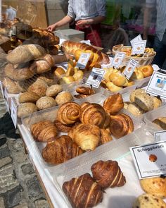 many different types of pastries are on display