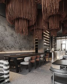 the interior of a restaurant with black and white chairs, tables, and hanging lights