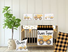 there is a baby crib bedding set with construction trucks on it and two pillow cases