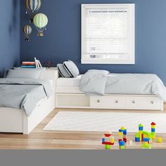 a child's bedroom with blue walls and white furniture