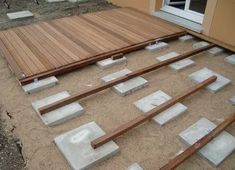 concrete blocks laid out on the ground to be poured into place for an outdoor deck