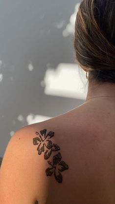 a woman with a tattoo on her back