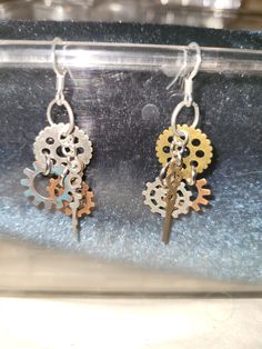 These earrings are made up of 3 gears and to clock hands all held together by jump rings. These earring are on hypo allergenic earring hooks. *All orders are shipped with a tracking number so you know where your package is at all times *In case of returning an order, the buyer will assume the shipping costs. The buyer will also bear customs charges if applicable. *If you have any questions, please contact me. I love my job and I will be happy to do it., Unique Handmade Earrings, I Love My Job, Industrial Jewelry, Clock Hands, Jewelry Unique, Earring Hooks, Love My Job, Steampunk Fashion, My Job