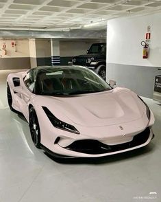 a white sports car parked in a garage