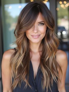 This long layered hairstyle features subtle sun-kissed highlights that brighten the dark base, paired with soft side bangs. The layers add movement and dimension, while the bangs create a flattering frame for round or oval face shapes. The warm tones of the highlights make this style perfect for summer or anytime you want a bright, fresh look. Long Hair Layers Side Part, Ombre Hair With Curtain Bangs, Side Bangstyle Hair Long Layers, Face Shaping Layers, Long Layers Side Bangs, Long Hair With Side Swept Bangs, Hair Cuts For Long Hair And Round Faces, Long Layers With Side Swept Fringe, Face Layers Long Hair