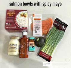 ingredients for salmon bowls laid out on a counter top with the words salmon bowls with spicy mayo