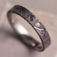 Meteorite Wedding Band With Three Stones Mens Ocean Wedding Rings, Comfortable Wedding Rings, Alternative Engagement Rings Men, Male Rings With Stones, Aquamarine Mens Wedding Band, Male Engagement Ring Men Silver, Alternative Wedding Rings Men, Opal Rings For Men, Unique Men’s Engagement Rings