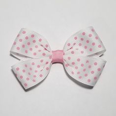 This polka dot hair bow measures 3".  The theme of this bow features pink polka dots printed on white ribbon.  This bow is great alone or perfect for pigtail bows, just order two! This bow is offered on an alligator clip, French barrette, FOE headband, or ponytail holder.  The alligator clip is 1 3/4" and partially lined (you can request alligator clip with teeth at checkout if you prefer them) and the French Barrette is 2".  The ponytail holder comes in two different sizes: TODDLER (1" round, 2 Polka Dot Hair, Sticker Page, Nail Aesthetic, Pigtail Bows, Cool Piercings, Bow Holder, French Barrette, 2000s Fashion Outfits, Gift Bows