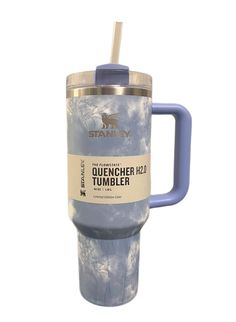 a blue travel mug with a straw in it