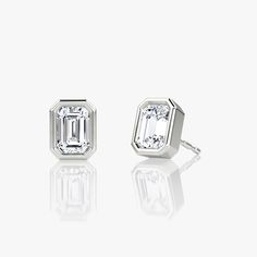 The Bezel Solitaire Studs combine vintage-inspired detail and modern appeal together for a look that’s timelessly elegant. Classic White Gold Earrings With Timeless Design, Classic White Gold Earrings, Timeless Platinum Earrings, Classic White Gold Baguette-cut Earrings, Classic Sterling Silver Earrings With Timeless Design, Luxury Timeless Silver Earrings, Elegant Timeless Diamond Earrings For Anniversary, Classic Sterling Silver Jewelry With Timeless Design, Classic Diamond Earrings With Polished Finish For Formal Events