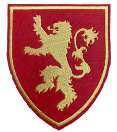 a red and gold lion emblem on a white background