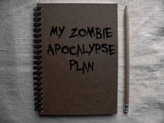 a notebook with the words my zombie apocalypse plan written on it next to a pencil