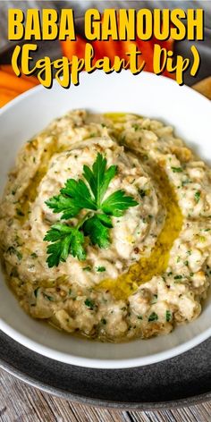 a white bowl filled with hummus and garnish