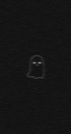 a black and white photo of a ghost in the dark