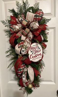 a christmas wreath hanging on the front door