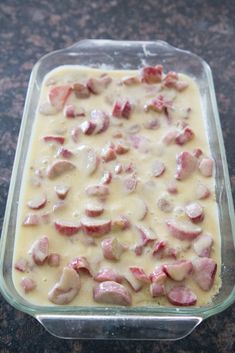 a glass dish filled with ham and cheese