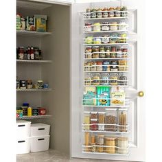 a pantry door is open to reveal the food in its storage compartment and it's contents