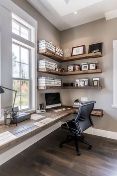 a home office with shelving, desk and chair in front of a large window