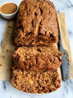 two slices of banana bread sitting on top of a cutting board