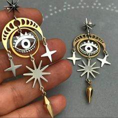 Super Cosmic Earrings In Silver And Gold Tone Metal. Palm Reader, Tarot, Witch. Just Reduced!! Do It Yourself Decoration, Antique Engagement Ring, Alloy Earrings, Evil Eye Pendant, Eye Earrings, Black Jewelry, Moon Earrings, Bijoux Diy, Star Earrings