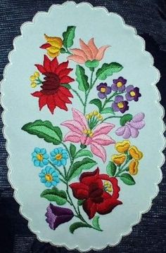 a white doily with colorful flowers on it