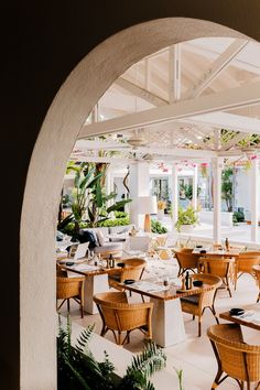 an outdoor dining area with tables and chairs