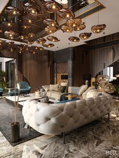 a living room with couches, chairs and chandeliers hanging from the ceiling