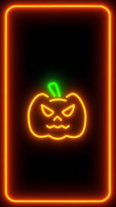 a neon sign with a glowing pumpkin on it