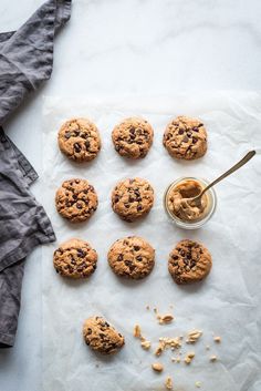 chocolate chip cookies and peanut butter on parchment paper