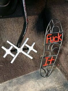 a close up of a metal object with the word flick written on it and another item in the background