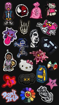 a bunch of stickers that are on a black surface