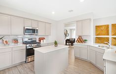 the kitchen is clean and ready for us to use in its new owner's home