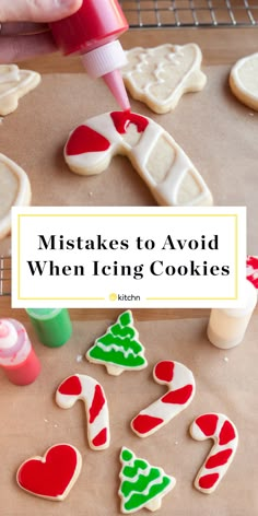 someone is decorating cookies with icing to make them look like christmas trees