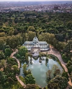 an aerial view of a large building surrounded by trees