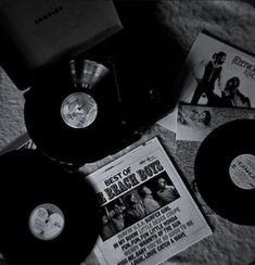 various records are laying on the floor next to each other