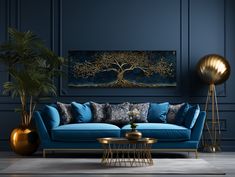 a living room with blue couches and gold accents on the walls, an art work hangs above it