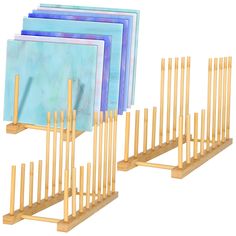 three wooden racks with blue and purple folders on each side, in front of a white background