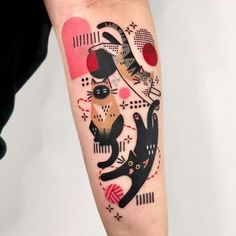 a person with a cat tattoo on their arm