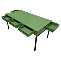 a green table with three drawers on each side and one drawer at the top that is open