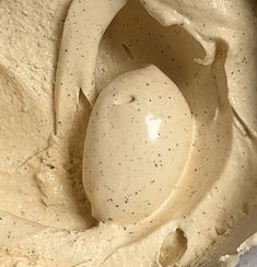 a close up view of a bowl filled with cream