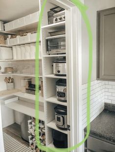 an open pantry with lots of food in it and the green line going across the door