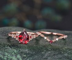 two different types of engagement rings on top of a rock