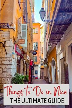 an alleyway with buildings and the words things to do in nice the ultimate guide