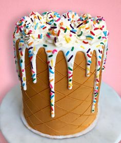 a cake with icing and sprinkles on it