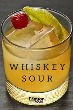 a glass filled with liquid and a cherry on the top that says whiskey sour, liquor com