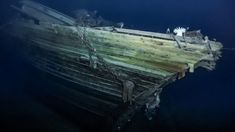 an old wooden boat in the water