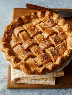 a freshly baked pie on a wooden tray